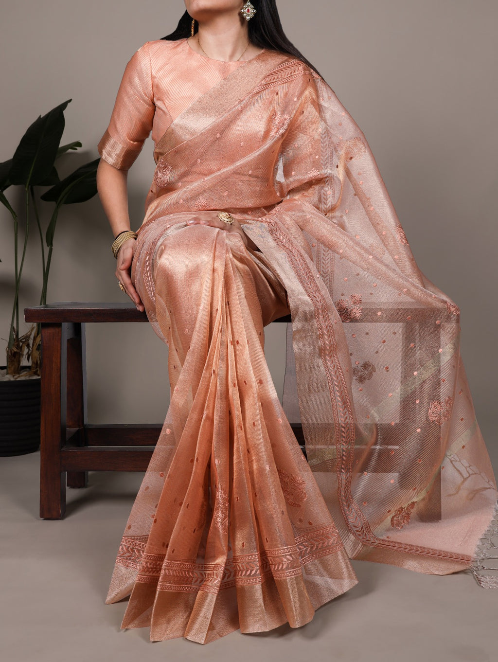 Elegance meets glamour — this poly shimmer saree.