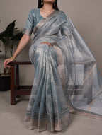 Elegance meets glamour — this poly shimmer saree.