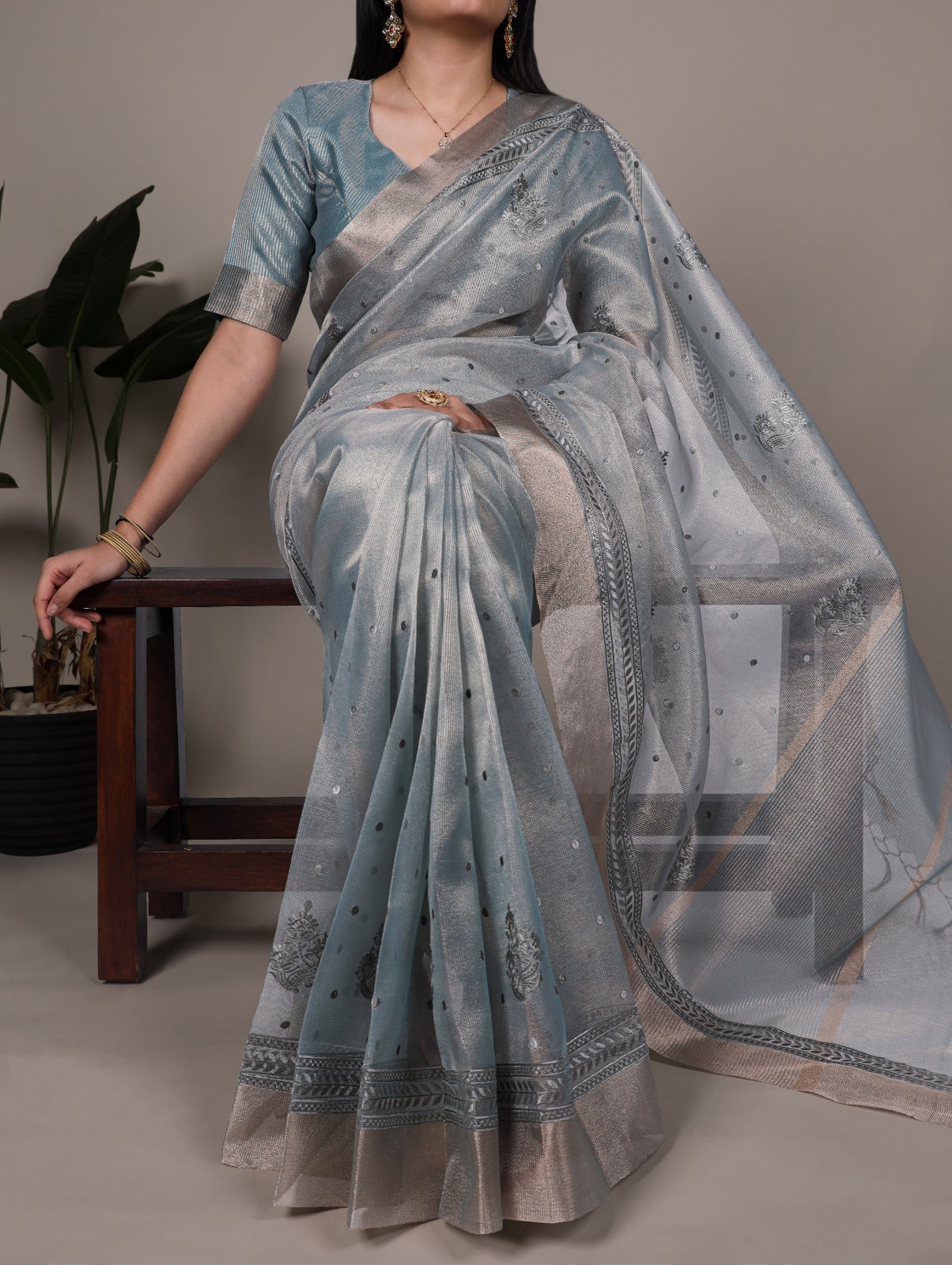 Elegance meets glamour — this poly shimmer saree.