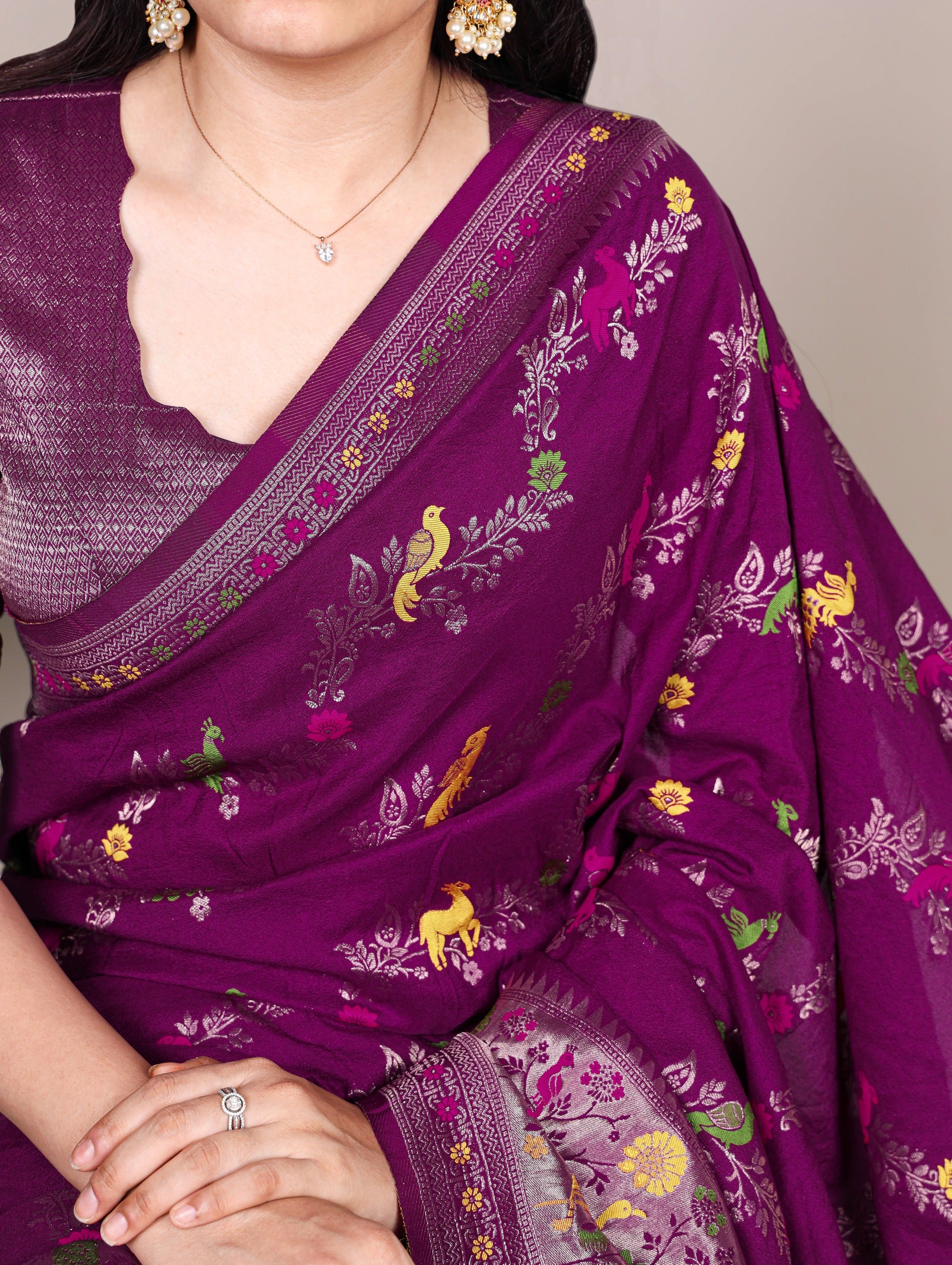 Naylon Easy drape, rich colors, and detailed weaving Saree